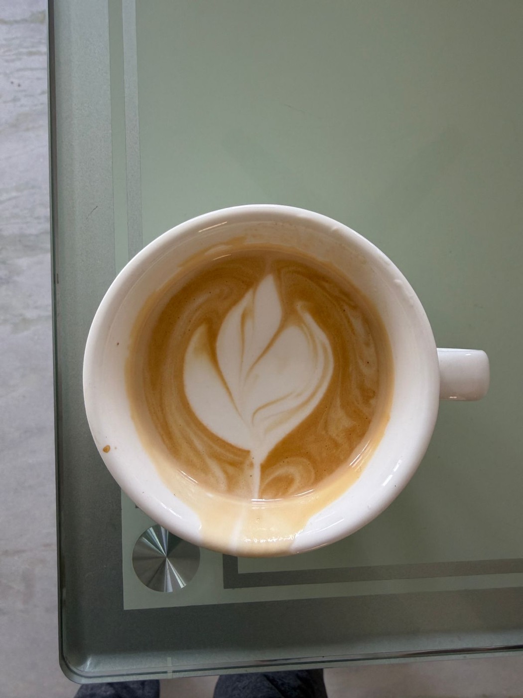 A latte with a tulip latte-art pattern
